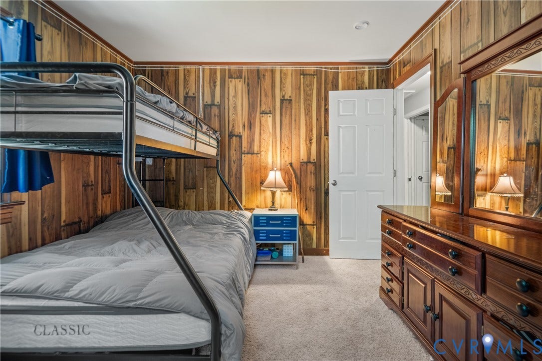 3940 Three Bridge Road, Powhatan, VA 23139 Wood-paneled wall finishes, recessed ceiling lighting, and carpeted flooring
