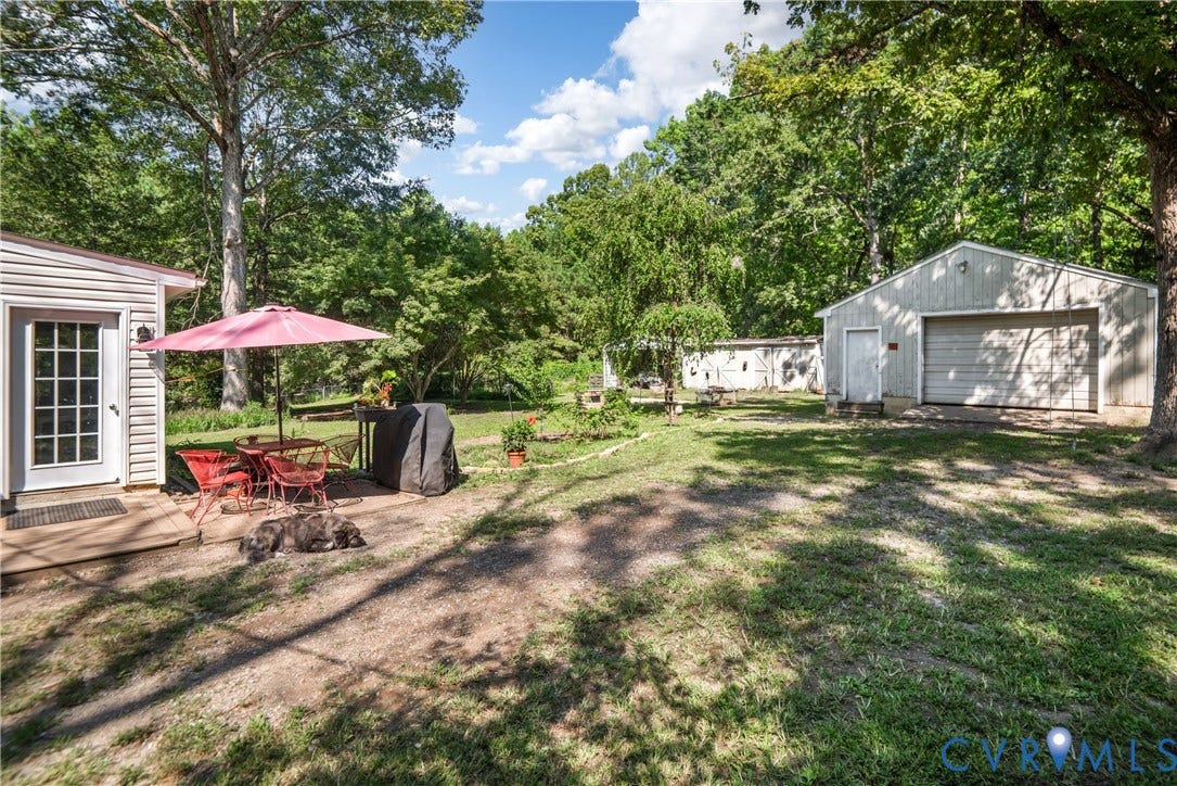 3940 Three Bridge Road, Powhatan, VA 23139 Detached garage structure, additional outbuildings, and a side entrance with a small deck