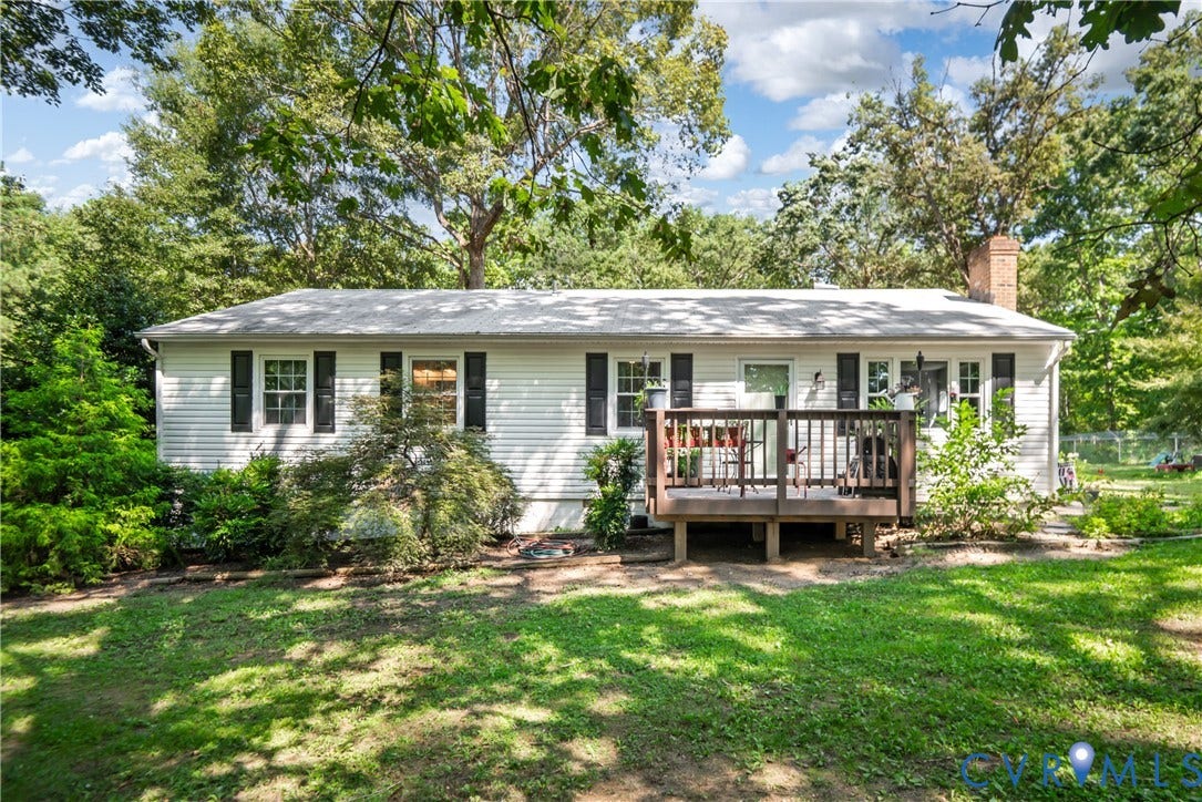 3940 Three Bridge Road, Powhatan, VA 23139 White horizontal siding exterior with black window shutters