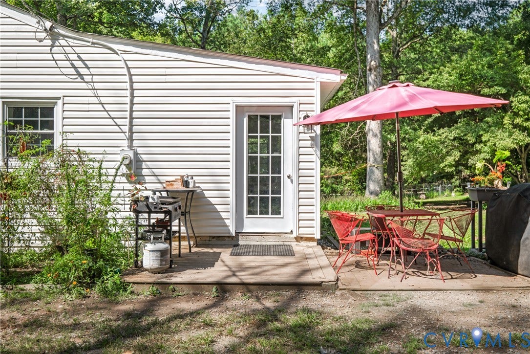 3940 Three Bridge Road, Powhatan, VA 23139 White siding exterior with a partial glass panel door
