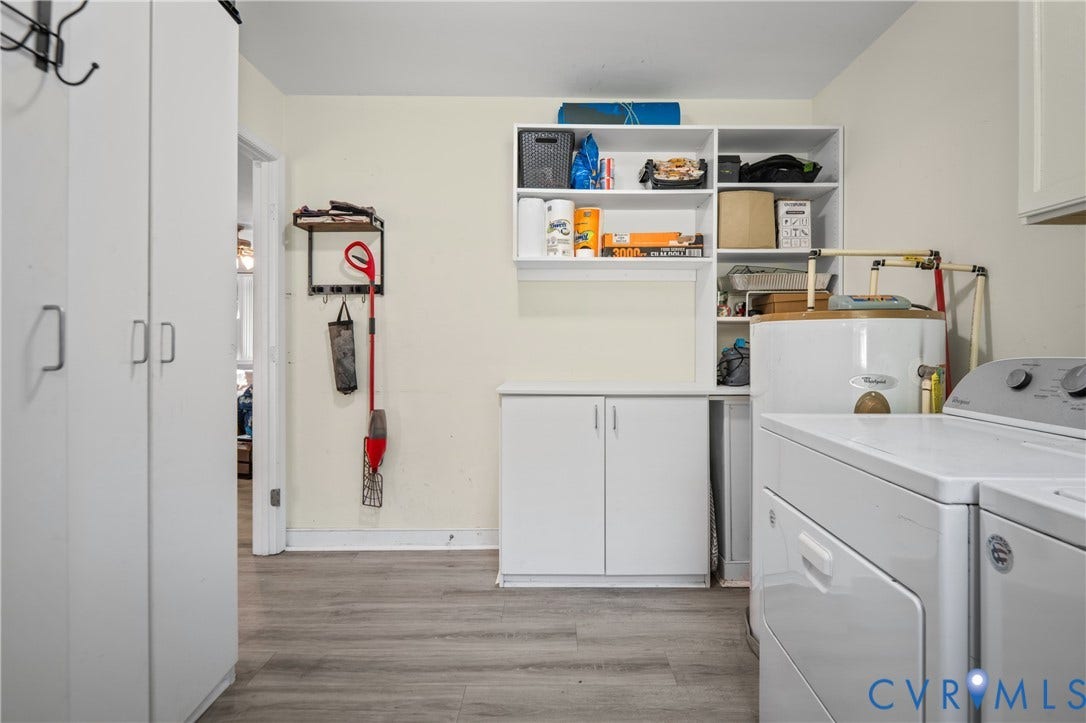 3940 Three Bridge Road, Powhatan, VA 23139 White cabinetry with silver-tone hardware, wood-finish flooring, and built-in shelving