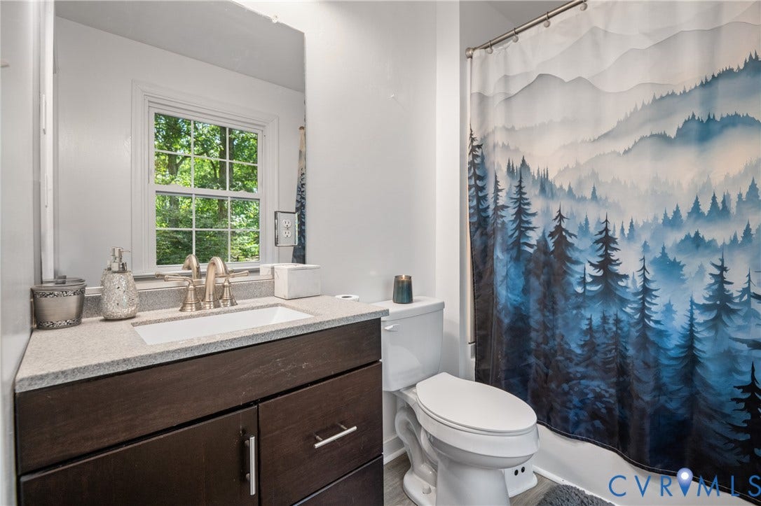 3940 Three Bridge Road, Powhatan, VA 23139 Vanity with a light-toned countertop, undermount sink, and brushed nickel faucet