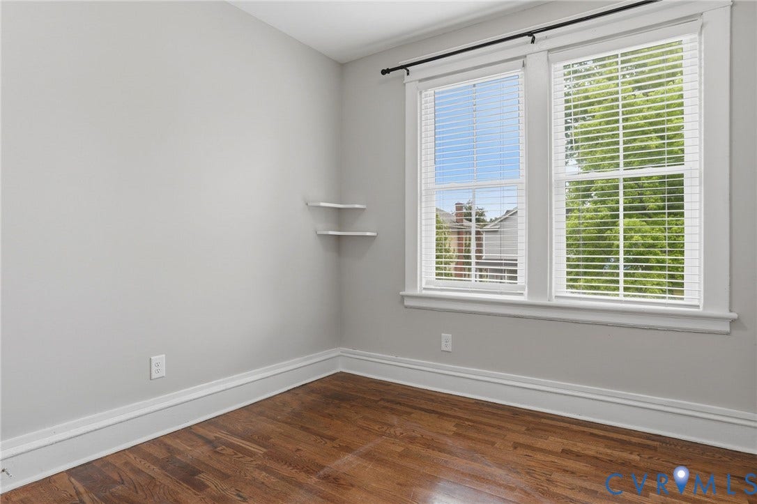 3110 3rd Avenue, North Highland Park, Richmond, VA 23222 Room featuring hardwood flooring, white baseboards, and light gray wall paint