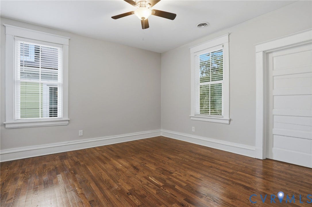 3110 3rd Avenue, North Highland Park, Richmond, VA 23222 Hardwood flooring throughout, two double-hung windows with blinds, a ceiling fan, and white trim work