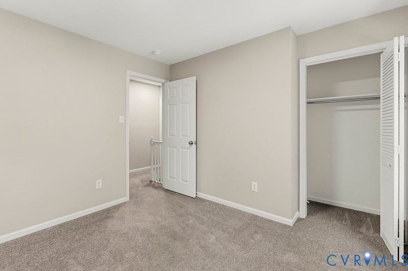 9007 Chatham Grove Lane, Richmond, VA 23236 Plush carpet flooring, light neutral wall paint, and a double-door closet with louvered bifold doors