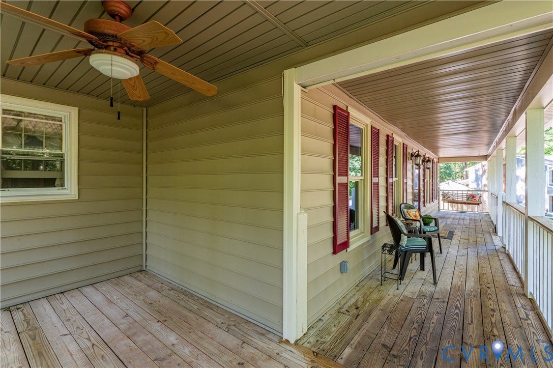 9007 Chatham Grove Lane, Richmond, VA 23236 Expansive covered porch with wood-finish flooring, white railing, recessed lighting, and a ceiling fan