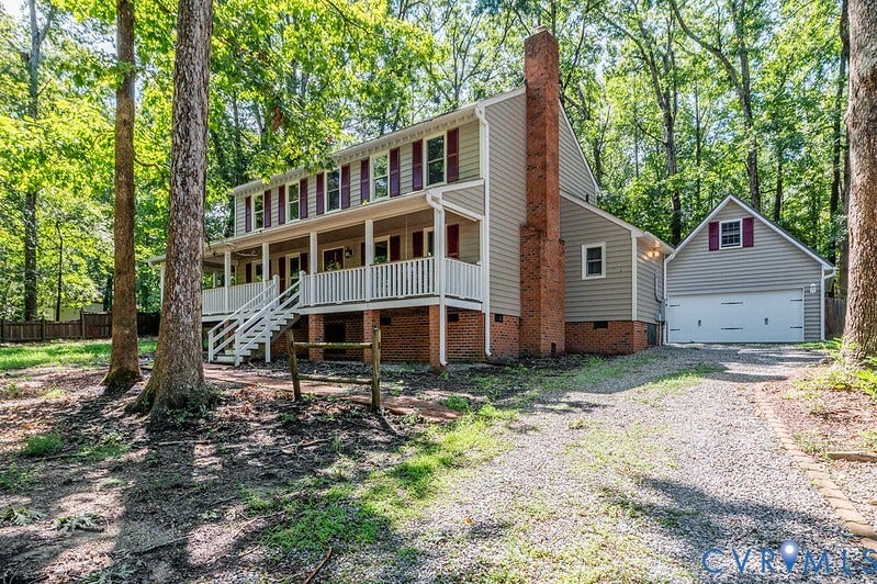 9007 Chatham Grove Lane, Richmond, VA 23236 Two-story property with a covered porch, white railing, and exterior staircase