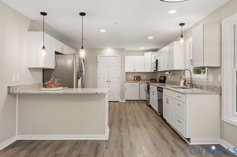 9007 Chatham Grove Lane, Richmond, VA 23236 Kitchen featuring wood-finish flooring, white cabinetry, stainless steel appliances, granite countertops, and recessed lighting