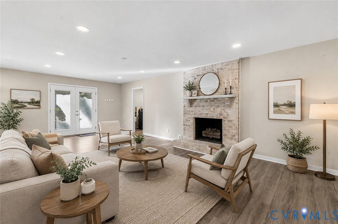 9007 Chatham Grove Lane, Richmond, VA 23236 Living area featuring a brick fireplace with a mantel, wood-finish flooring, recessed lighting, and double glass-panel doors - Ai Enhanced Image