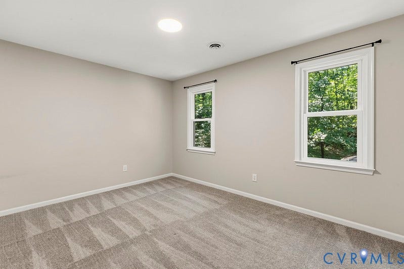 9007 Chatham Grove Lane, Richmond, VA 23236 Recessed ceiling lighting, two double-hung windows with white trim, and light gray patterned carpeting
