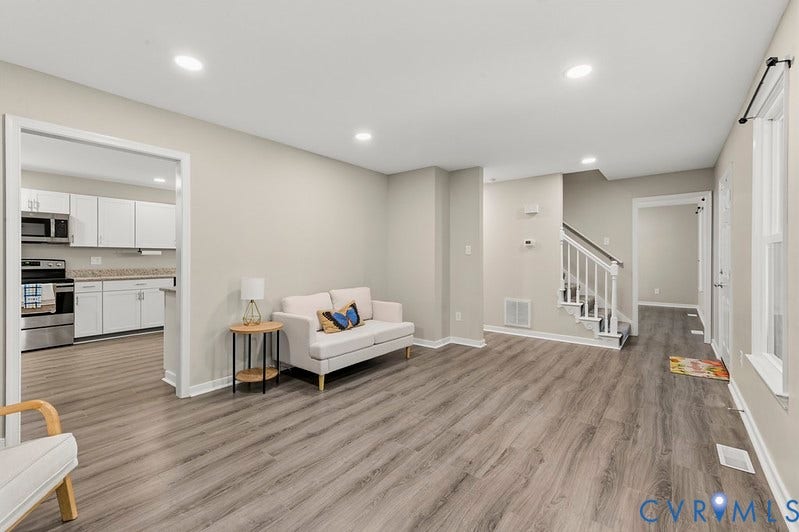 9007 Chatham Grove Lane, Richmond, VA 23236 Open concept living space with recessed lighting, wood-finish flooring, and neutral wall tones
