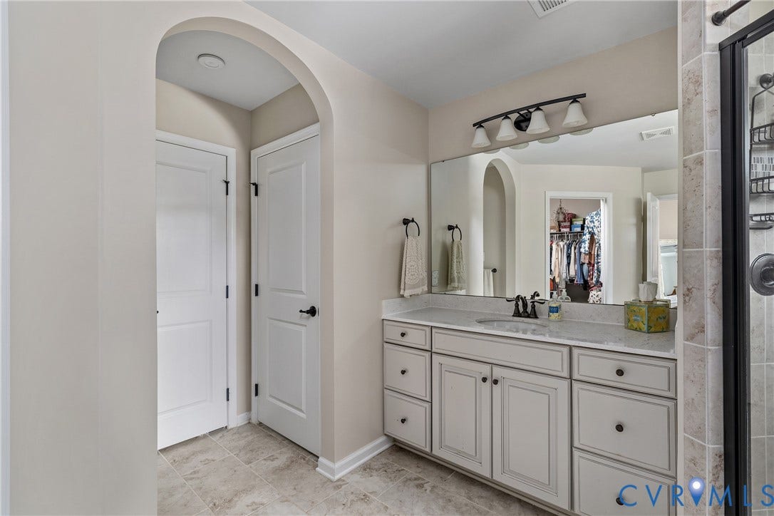 11612 Rolling Leaf Lane, Emerson Mill, Glen Allen, VA 23059 Water closet, linen closet and 1 of 2 vanities