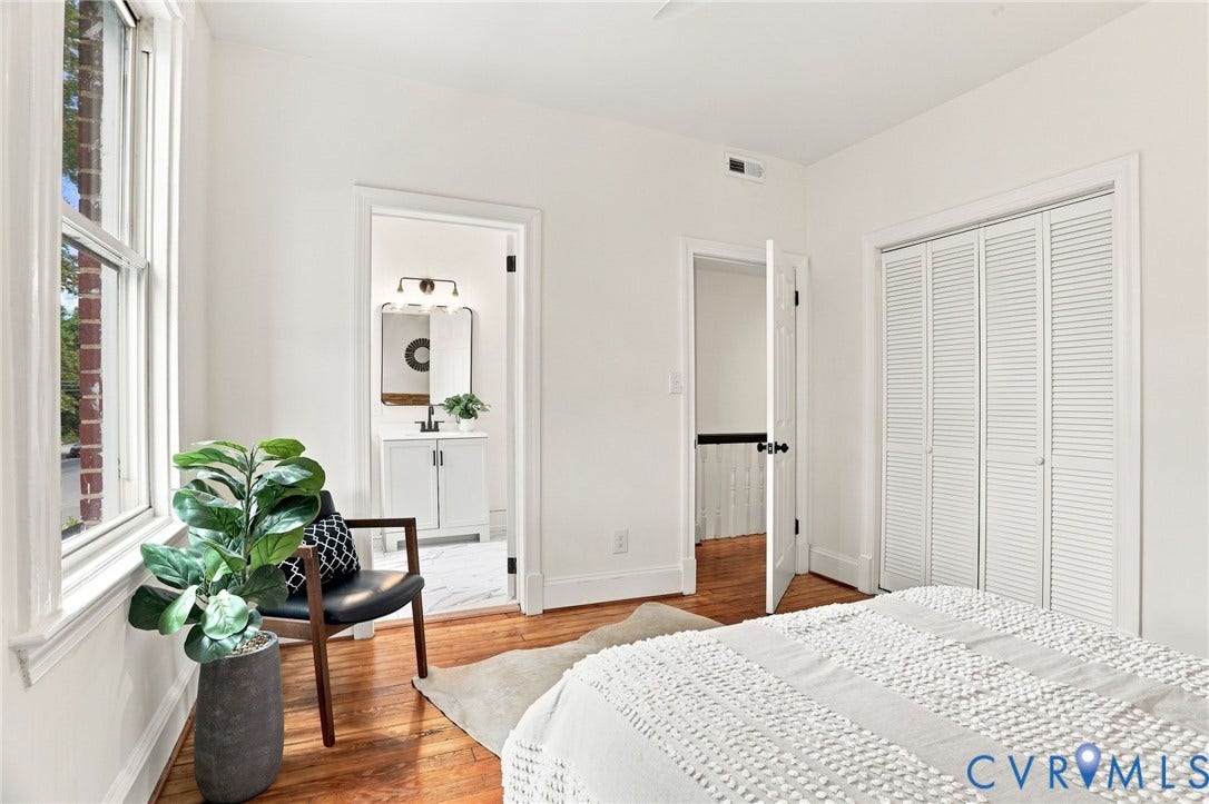 625 N 33rd Street, Chimborazo, Richmond, VA 23223 Hardwood flooring throughout, louvered bi-fold closet doors, white trim, and a window with white casing