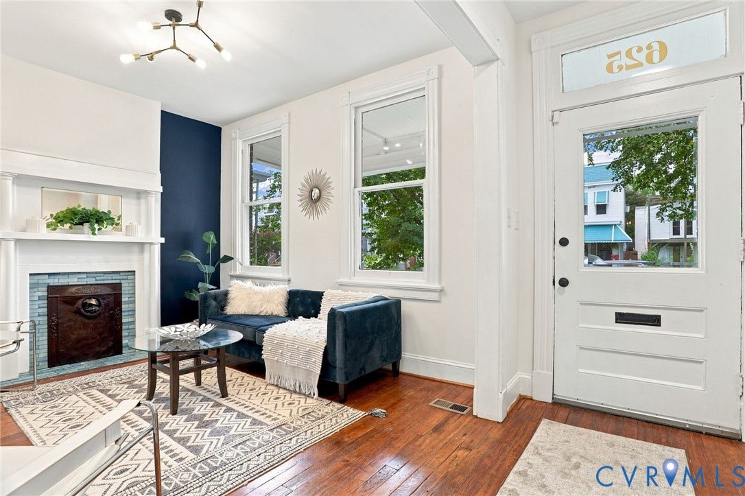625 N 33rd Street, Chimborazo, Richmond, VA 23223 Bright foyer featuring hardwood flooring, white trim detailing, and abundant natural light from multi-pane windows and transom glass
