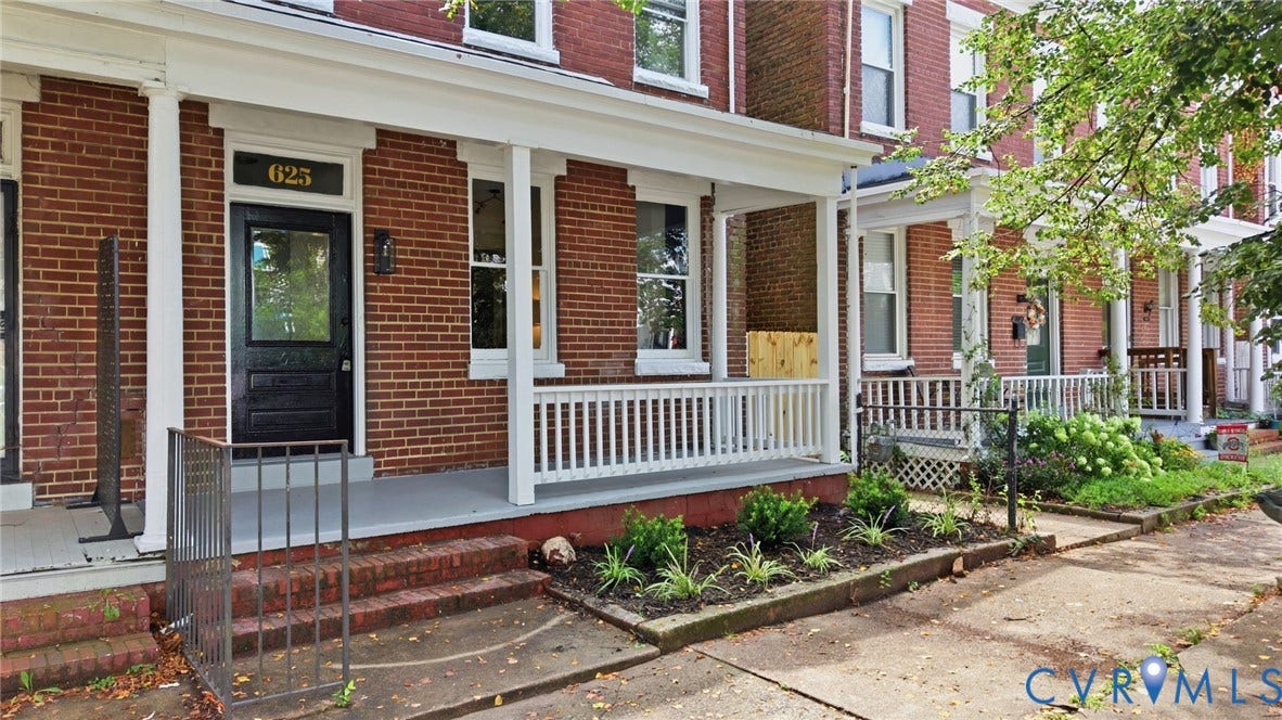625 N 33rd Street, Chimborazo, Richmond, VA 23223 Brick facade with white porch columns, white porch railing, and a black front door with decorative glass inserts