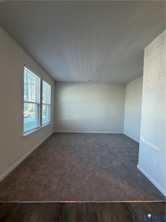 4184 Park Trail Drive, Henrico, VA 23223 Carpeted living area featuring multiple windows with blinds, recessed lighting, and a wood-finish flooring transition