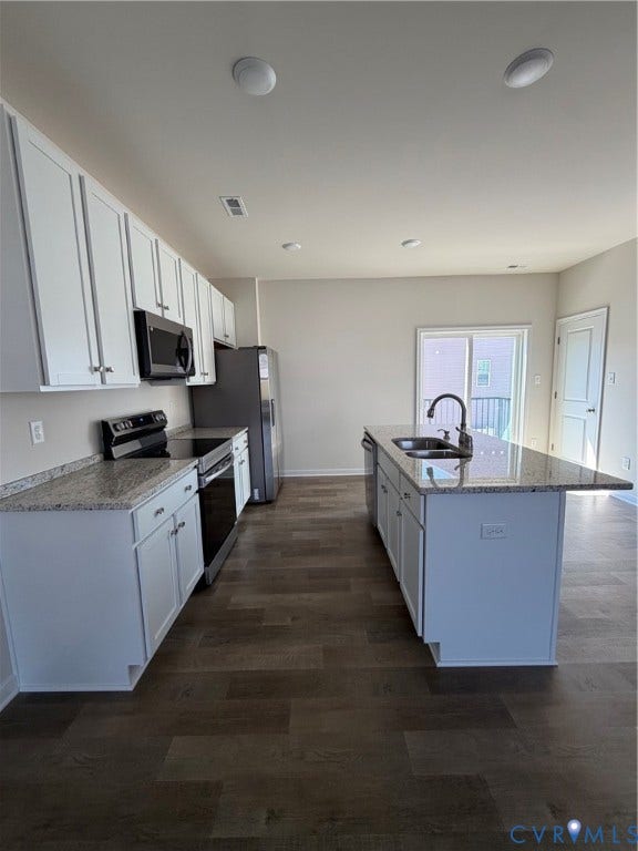 4184 Park Trail Drive, Henrico, VA 23223 Contemporary kitchen featuring white cabinetry, granite-style countertops, stainless steel appliances, a center island with sink, and wood-finish flooring