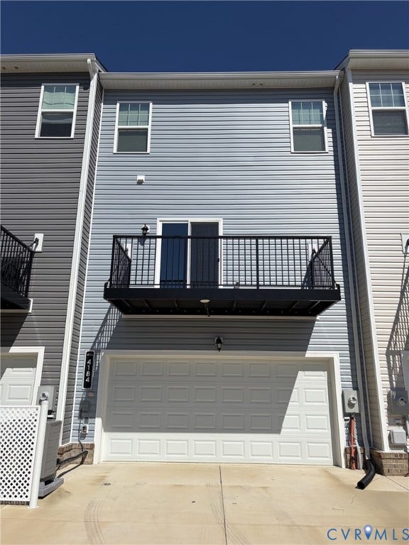 4184 Park Trail Drive, Henrico, VA 23223 Multi-level townhome exterior featuring light blue vinyl siding