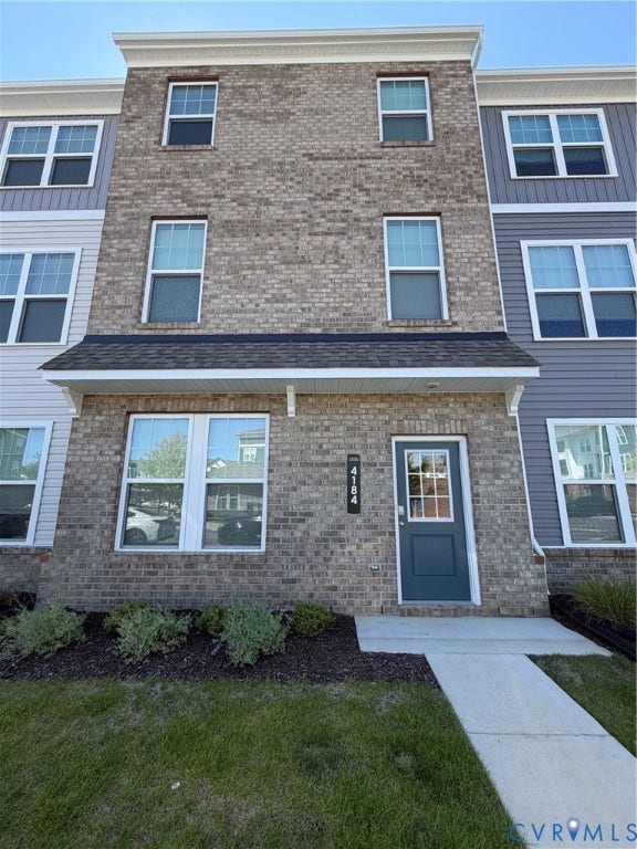 4184 Park Trail Drive, Henrico, VA 23223 Multi-story townhouse featuring a brick facade with light gray siding accents