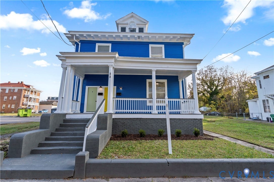 22 Corling Street, Poplar Hall, Petersburg, VA 23803 Blue two-story residence with a prominent front porch, white columns, and a dormer window
