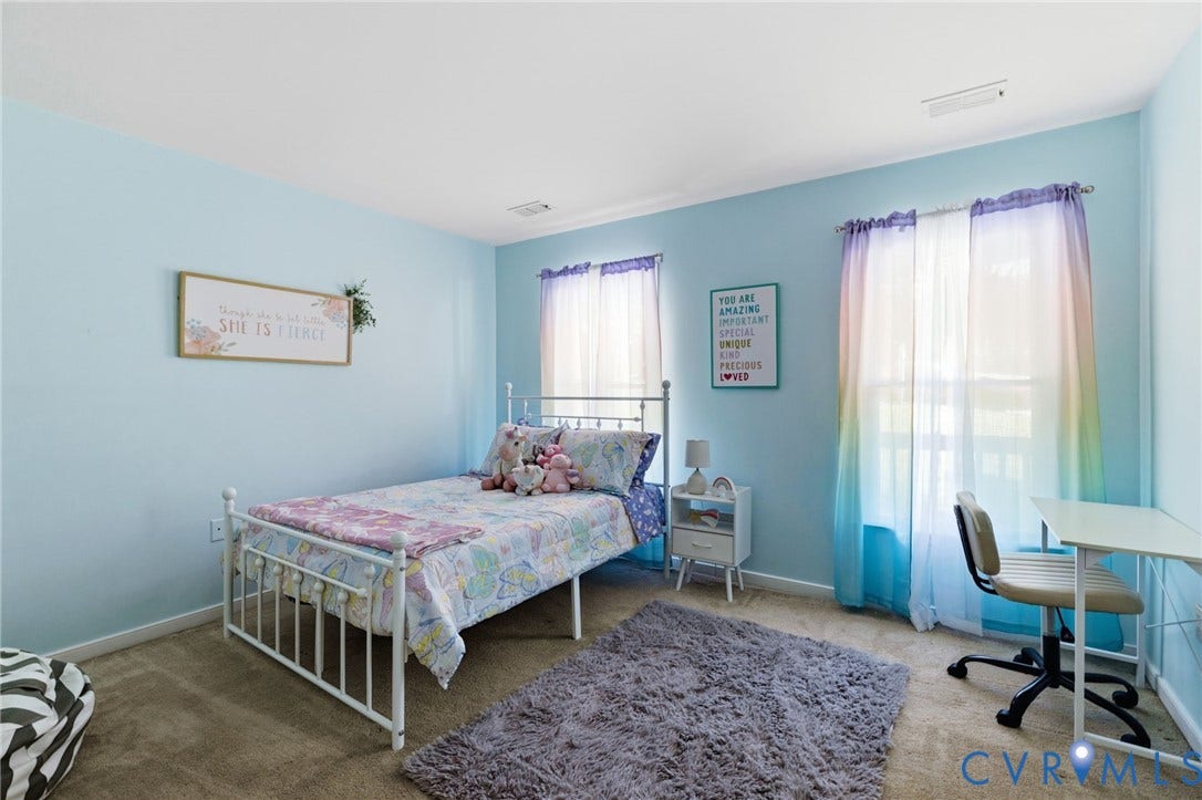 7306 Native Dancer Drive, Midlothian, VA 23112 Carpeted flooring, light blue wall paint, and two windows with blinds
