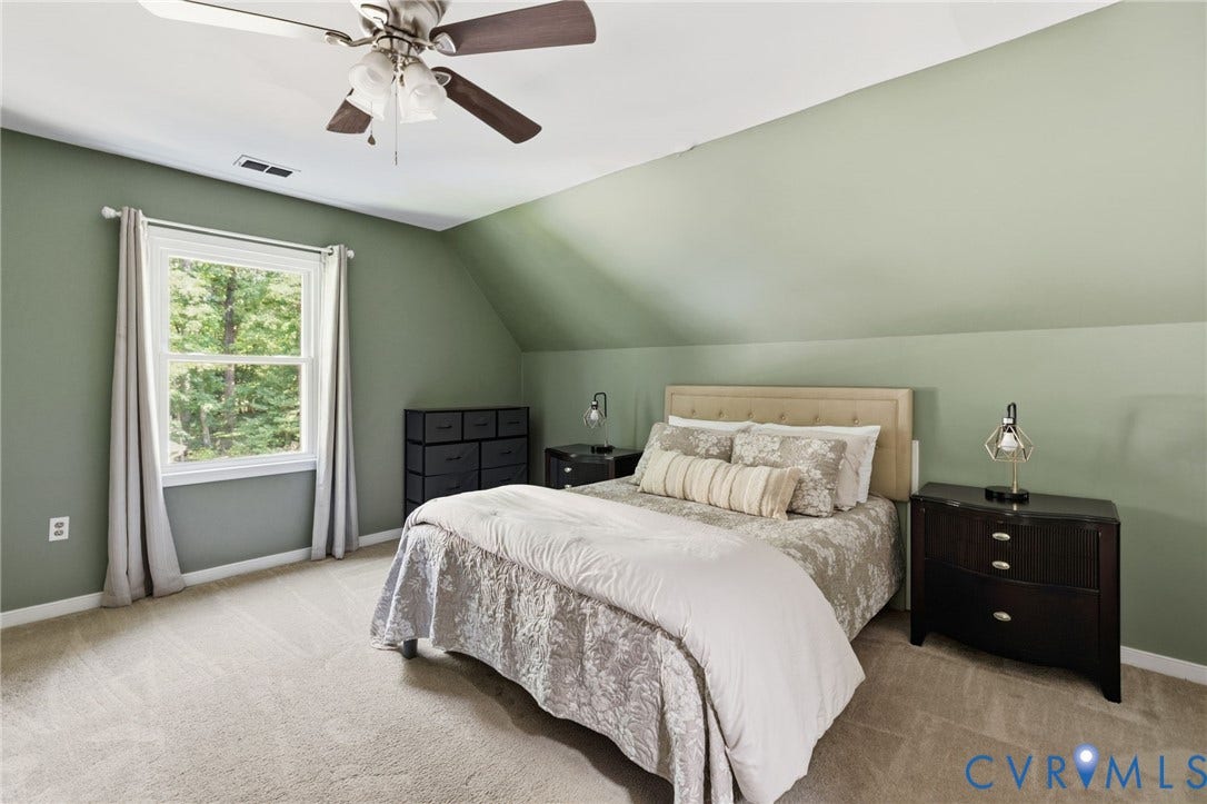 7306 Native Dancer Drive, Midlothian, VA 23112 Angled ceiling lines, carpeted flooring, window with natural light, and a ceiling fan with integrated lighting