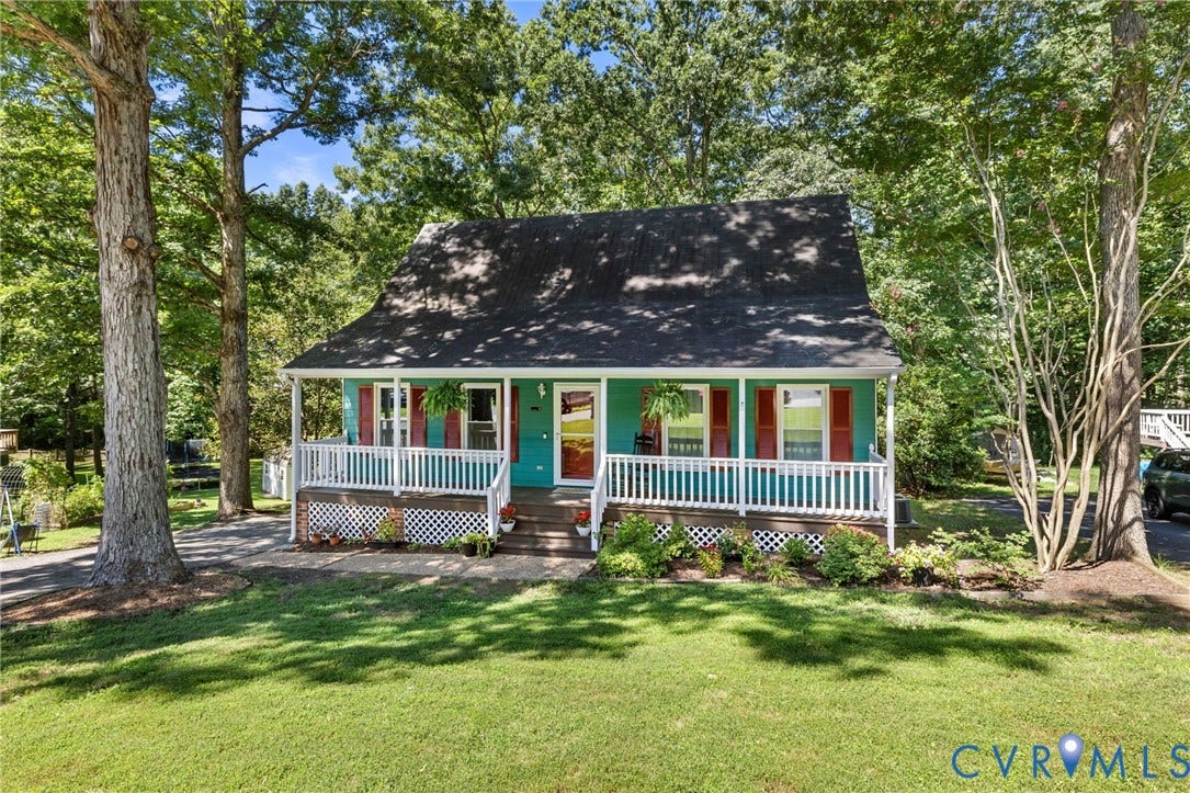 7306 Native Dancer Drive, Midlothian, VA 23112 Charming cottage with a covered front porch, white railing, and red shutters