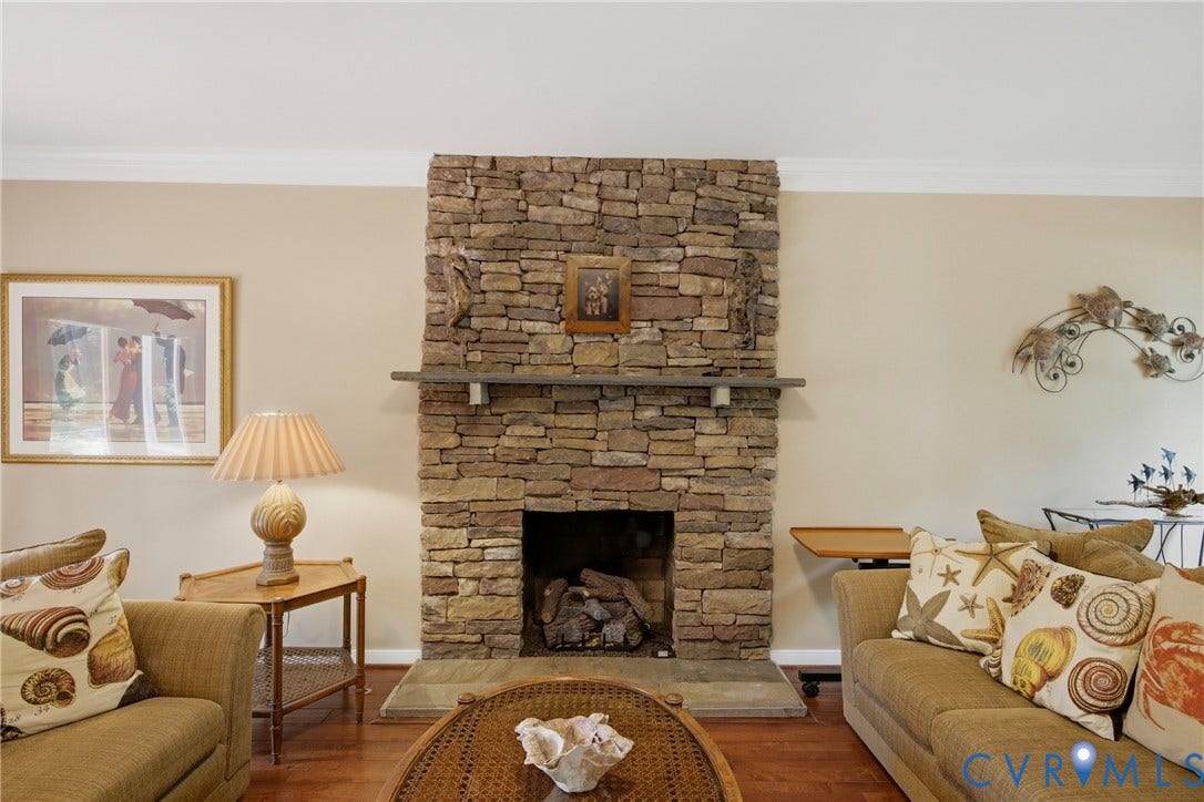 Gas fireplace with stone accents and slate mantel and hearth