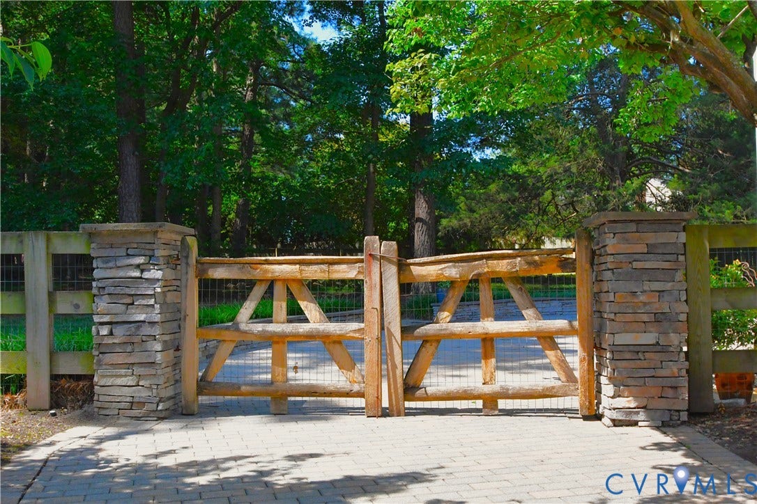 Stone pillars at the end of the driveway, time to enter your Oasis