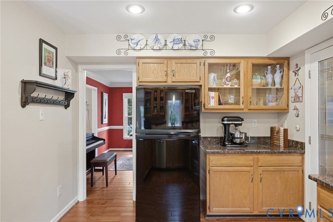 This kitchen features lots of storage and a pantry