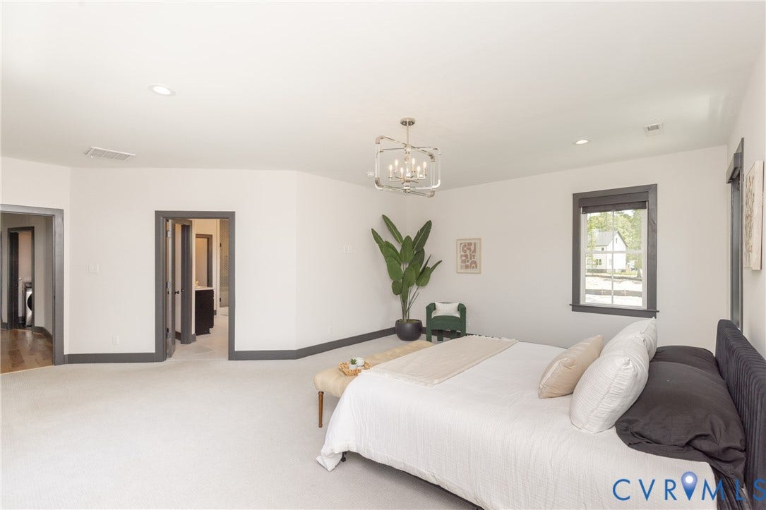 4600 Otter Court, Moseley, VA 23120 Spacious room featuring light-toned carpeting and white walls with dark trim