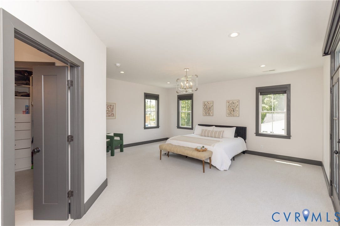 4600 Otter Court, Moseley, VA 23120 Spacious room featuring light-toned carpeting and contrasting dark trim