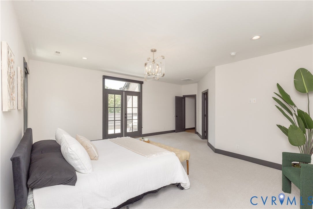 4600 Otter Court, Moseley, VA 23120 Spacious room featuring light-colored carpeting, white walls, and dark trim