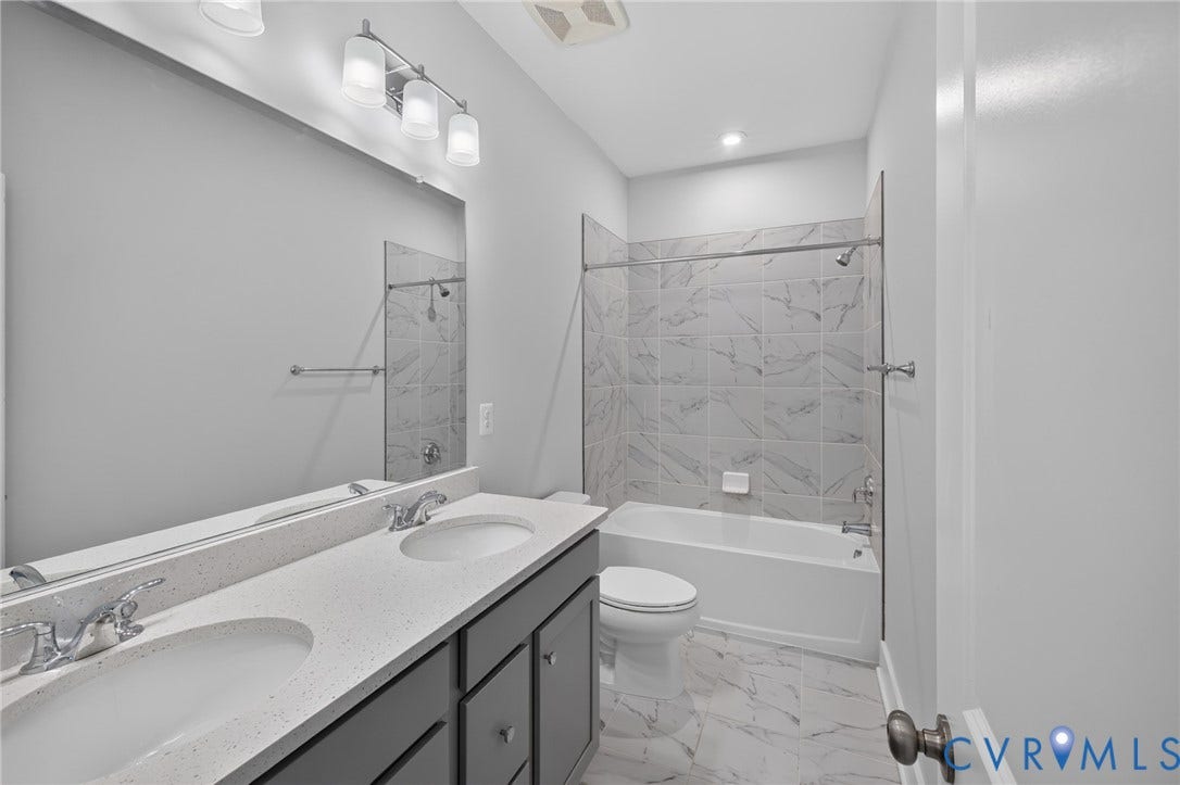 1509 Moore Street, #B, Richmond, VA 23220 Double vanity with light-toned countertop, chrome fixtures, and undermount sinks