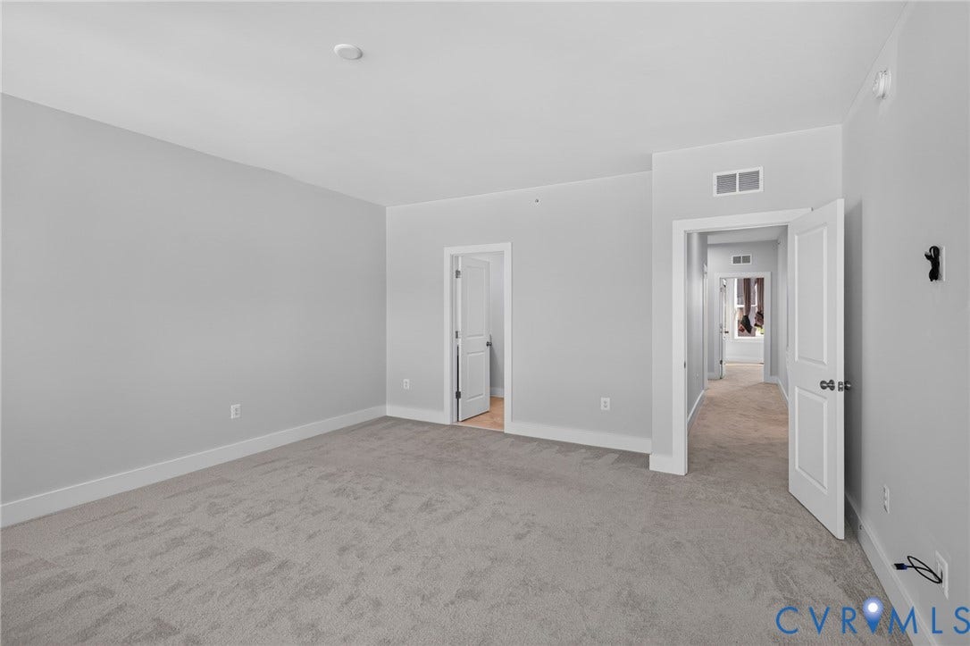 1509 Moore Street, #B, Richmond, VA 23220 Expansive room with neutral carpeting, light gray wall paint, and white trim