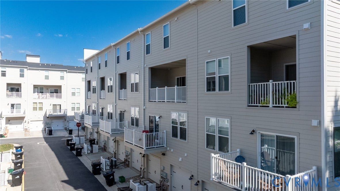 1509 Moore Street, #B, Richmond, VA 23220 Multi-level townhome exterior featuring light gray siding