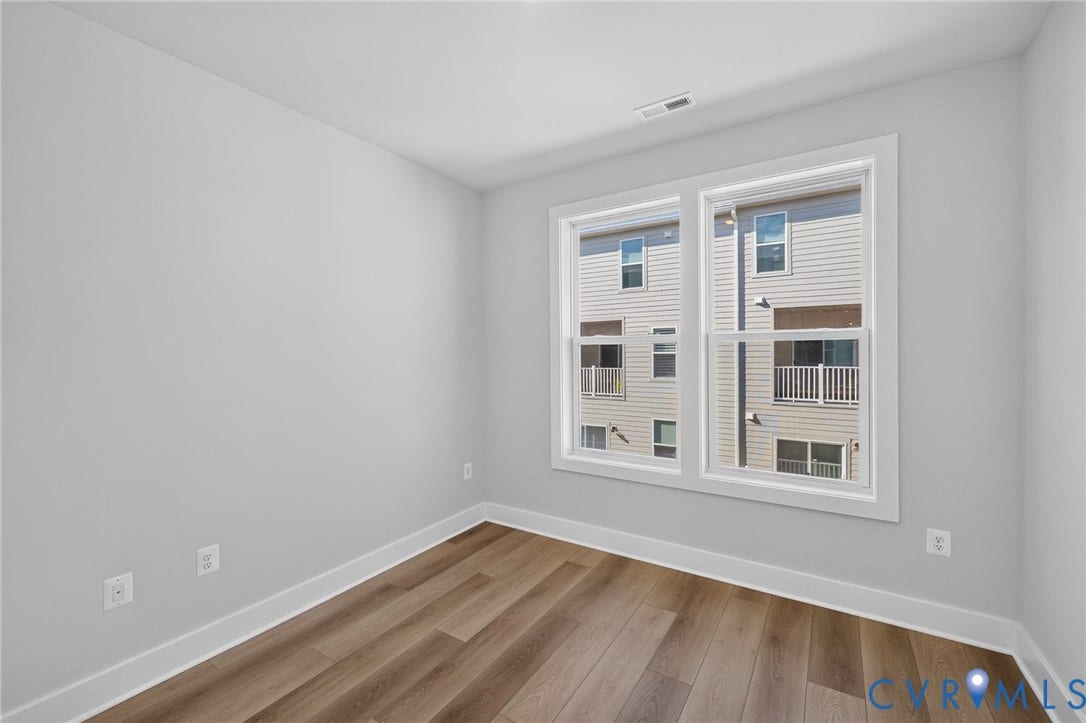 1509 Moore Street, #B, Richmond, VA 23220 Wood-finish flooring, white trim, and light gray walls