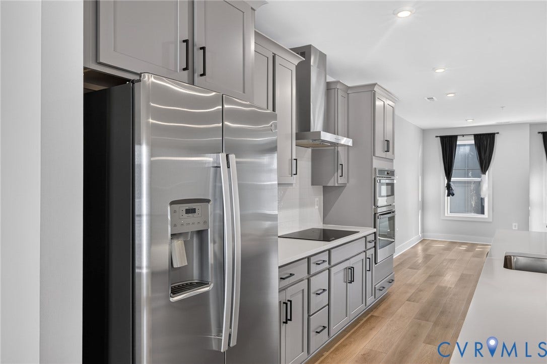 1509 Moore Street, #B, Richmond, VA 23220 Stainless steel appliances, flat-panel cabinetry, light wood-finish flooring, recessed lighting, and a built-in oven