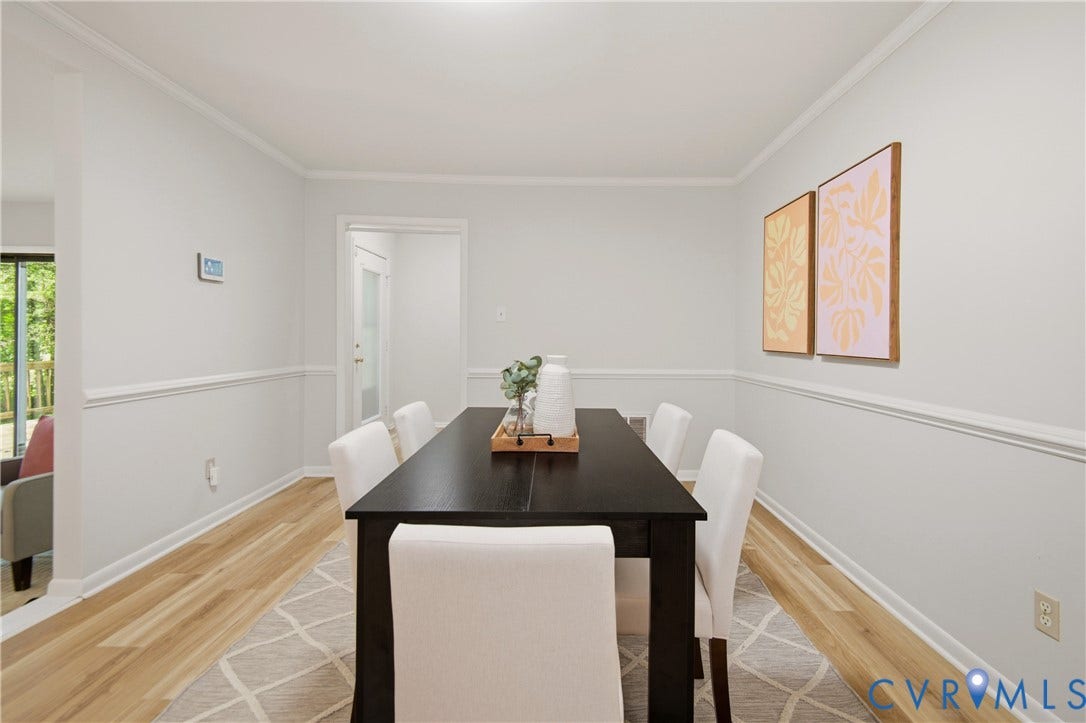 2903 Fox Chase Drive, Huntsbridge, Midlothian, VA 23112 Dining area featuring light-tone wood-finish flooring, crown molding, and chair rail detailing