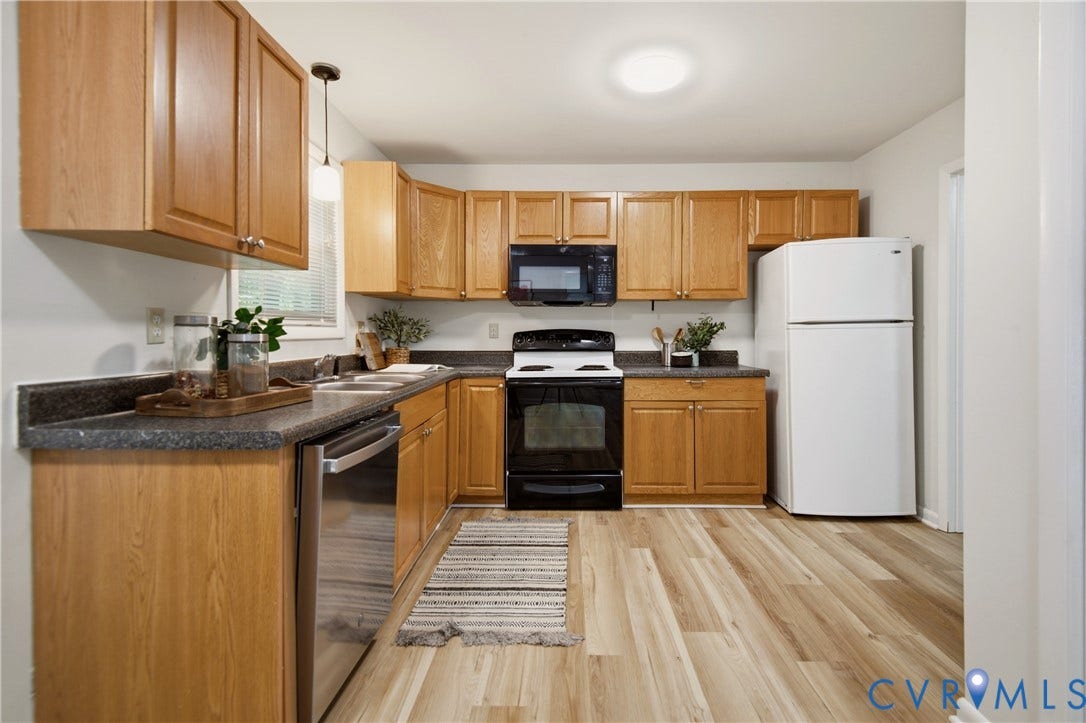 2903 Fox Chase Drive, Huntsbridge, Midlothian, VA 23112 Kitchen featuring wood-finish flooring, light wood cabinetry, dark countertops, a double basin sink, and a stainless steel dishwasher
