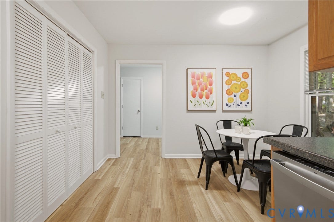 2903 Fox Chase Drive, Huntsbridge, Midlothian, VA 23112 Dining area featuring wood-finish flooring, a contemporary overhead light fixture, and a window with blinds