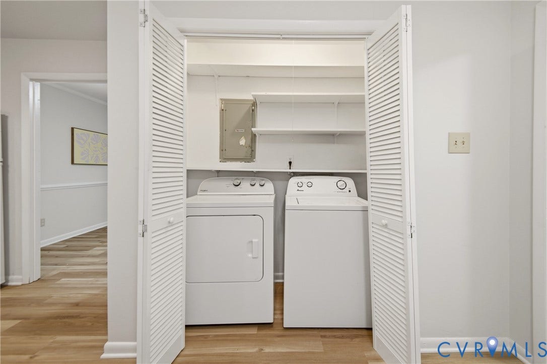 2903 Fox Chase Drive, Huntsbridge, Midlothian, VA 23112 Dedicated laundry closet with bi-fold louvered doors, integrated shelving, and wood-finish flooring