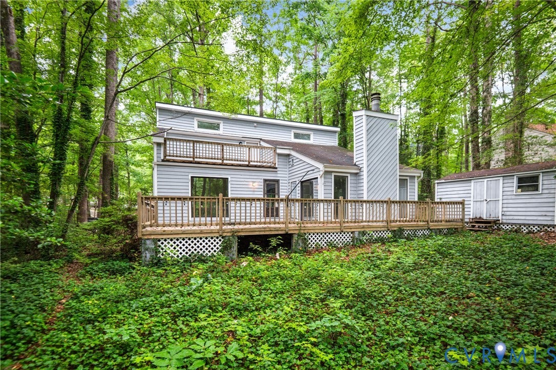 2903 Fox Chase Drive, Huntsbridge, Midlothian, VA 23112 Contemporary home featuring a multi-level deck with wood railings and horizontal siding, set among mature landscaping