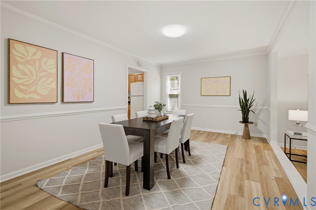 2903 Fox Chase Drive, Huntsbridge, Midlothian, VA 23112 Elegant dining room featuring a dark wood table with upholstered chairs, crown molding detail, and wainscoting throughout