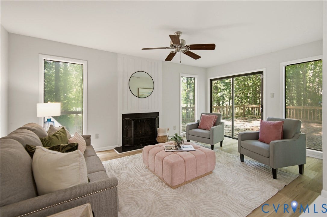 2903 Fox Chase Drive, Huntsbridge, Midlothian, VA 23112 Bright living area featuring wood-finish flooring, a fireplace with a white shiplap-style surround, and a ceiling fan