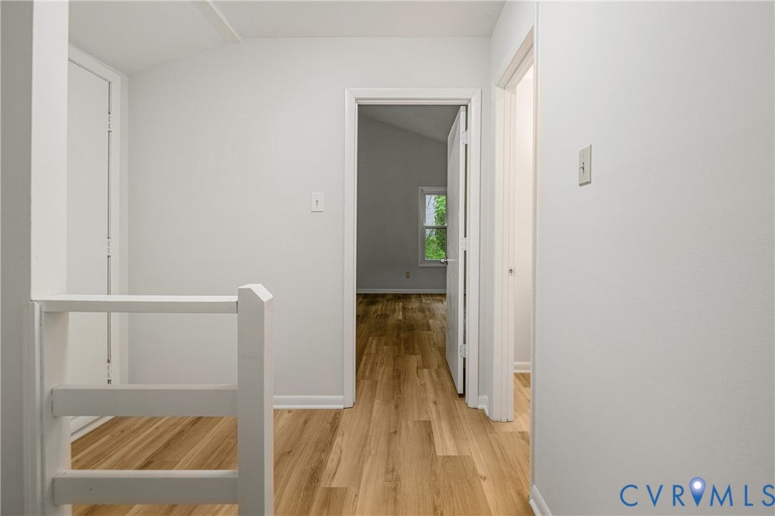 2903 Fox Chase Drive, Huntsbridge, Midlothian, VA 23112 Hallway featuring light wood-finish flooring, white walls, and a white balustrade