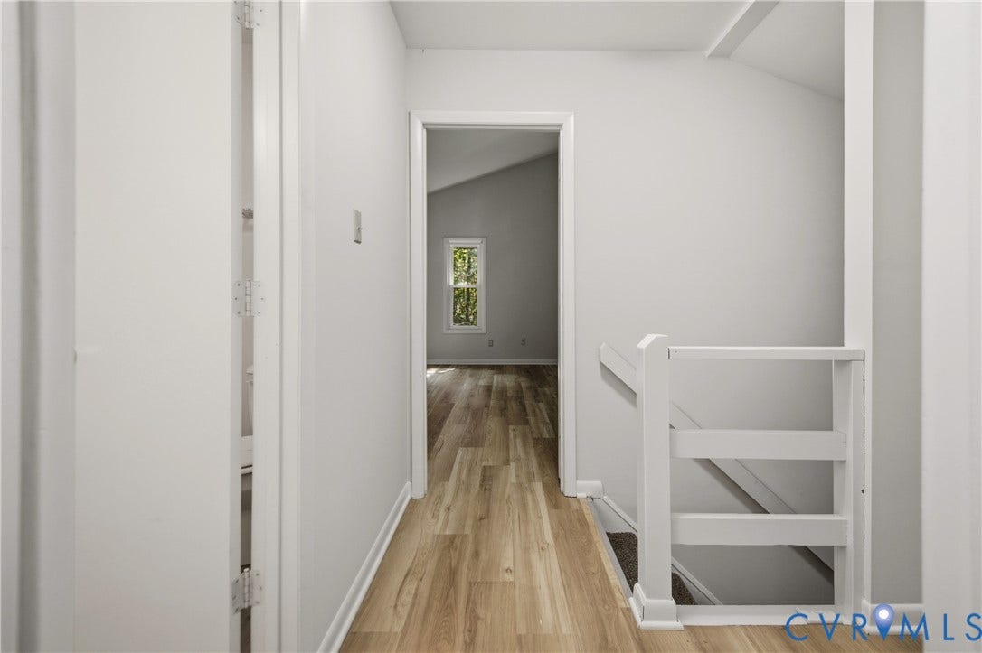 2903 Fox Chase Drive, Huntsbridge, Midlothian, VA 23112 Bright hallway with wood-finish flooring, white painted walls, and clean architectural lines