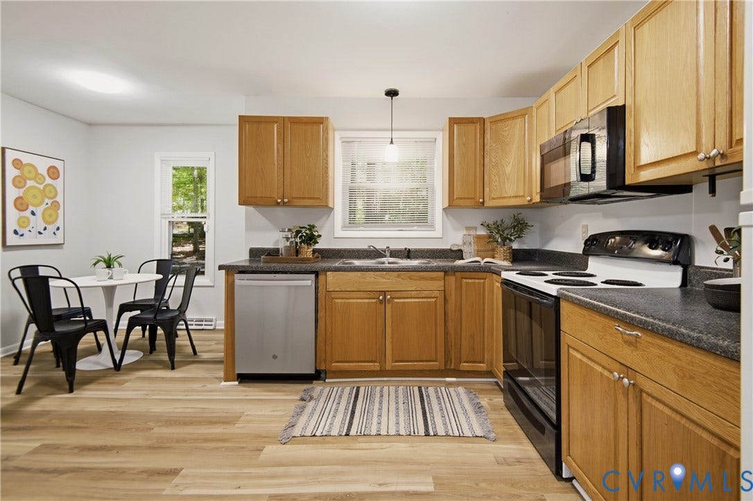 2903 Fox Chase Drive, Huntsbridge, Midlothian, VA 23112 Kitchen featuring wood-finish cabinetry, dark countertops, a stainless-steel dishwasher, and a black range with an overhead microwave