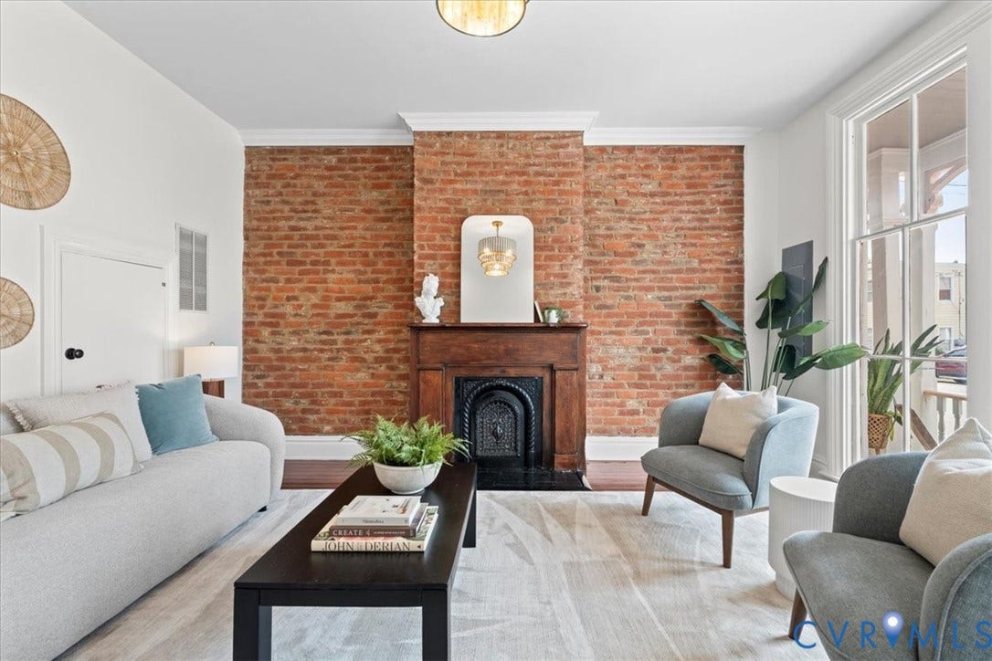 2510 E Leigh Street, Church Hill, Richmond, VA 23223 Exposed brick accent wall, wood-finish flooring, and crown molding
