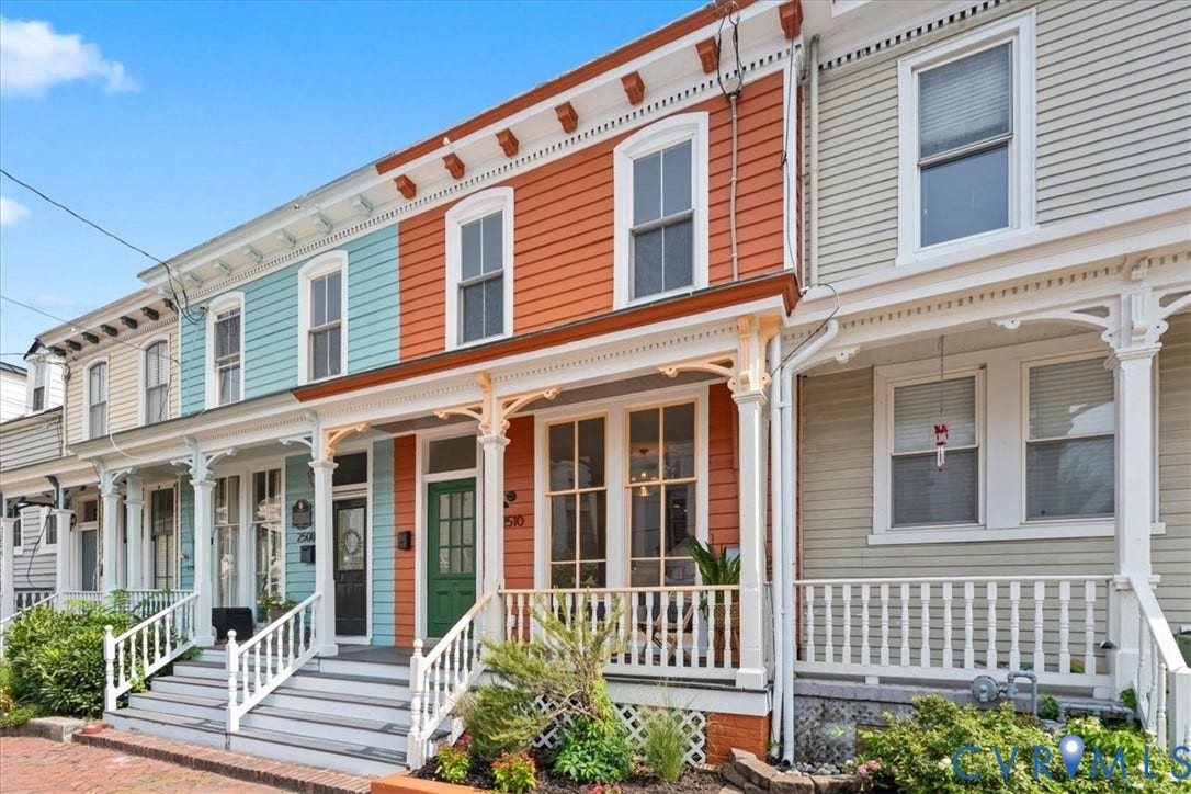 2510 E Leigh Street, Church Hill, Richmond, VA 23223 Vibrant multi-story facade with ornate white trim, an inviting front porch, and a classic green entry door